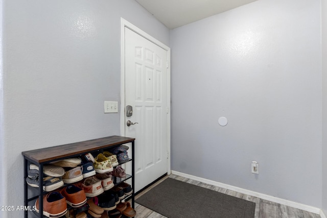 4034 E Mine Shaft Rd, San Tan Valley, AZ 85143 - foyer entrance featuring wood finished floors and baseboards