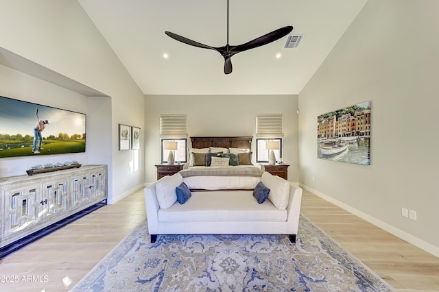 bedroom featuring ceiling fan, high vaulted ceiling, and light wood-type flooring