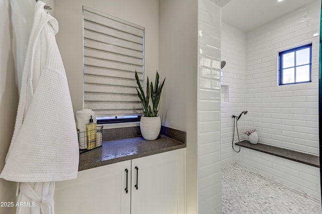 bathroom featuring tiled shower