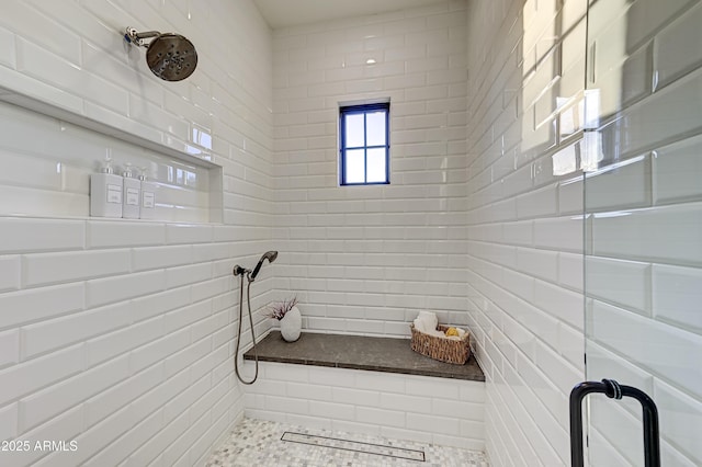 bathroom featuring tiled shower