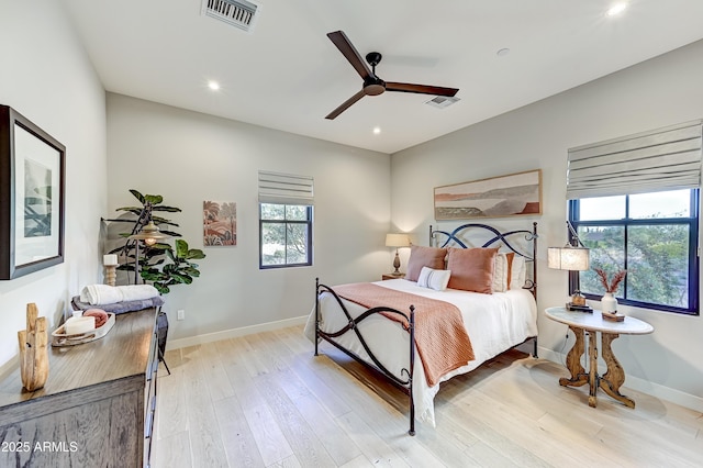 bedroom featuring ceiling fan and light hardwood / wood-style floors