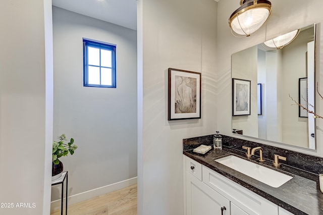 bathroom with vanity and hardwood / wood-style flooring