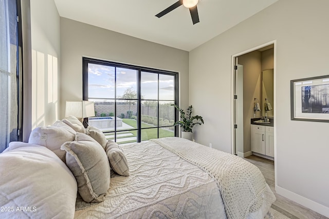 bedroom featuring ceiling fan, wood-type flooring, and connected bathroom