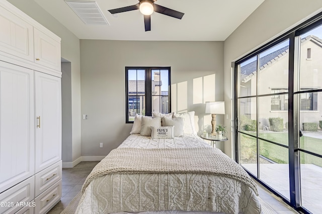 bedroom featuring ceiling fan, access to exterior, and light tile patterned floors