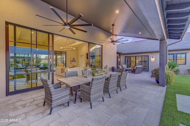 view of patio with outdoor lounge area and ceiling fan