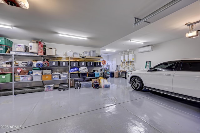 garage with a garage door opener and a wall mounted air conditioner