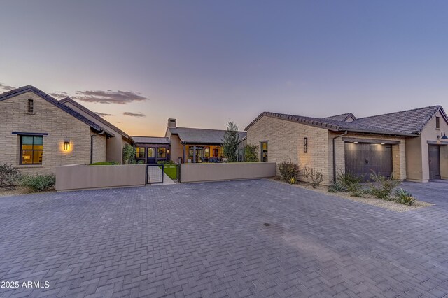 view of front of home with a garage