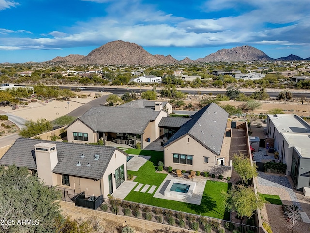 birds eye view of property featuring a mountain view