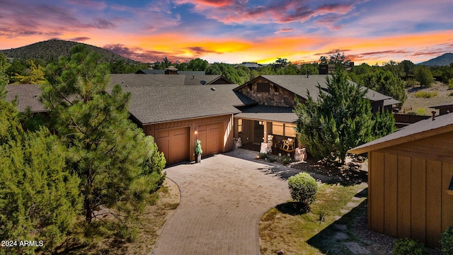 view of front of house with a garage and a mountain view