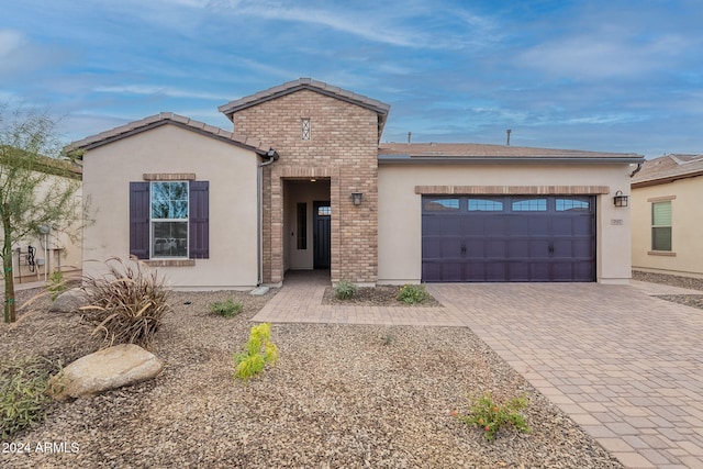 view of front of property with a garage