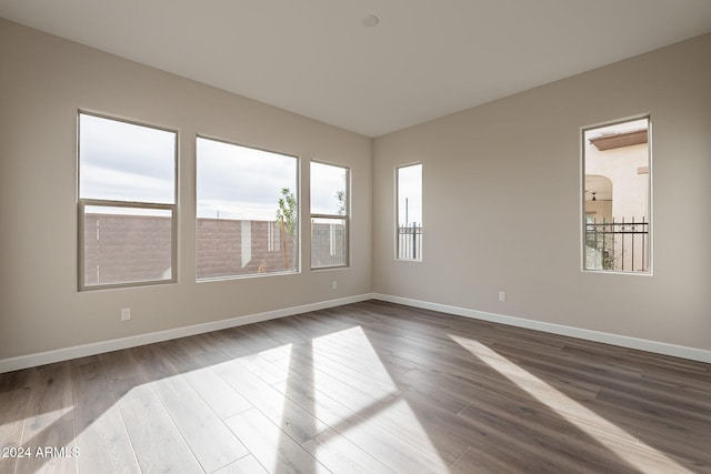 spare room with hardwood / wood-style floors