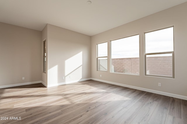 unfurnished room featuring light wood-type flooring