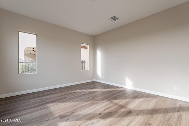 empty room with wood-type flooring