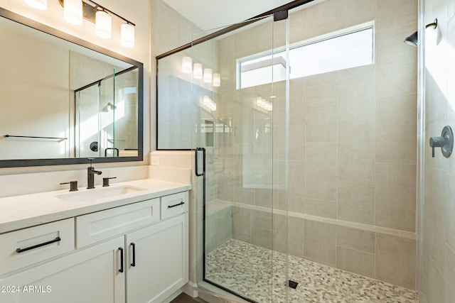 bathroom with vanity and an enclosed shower