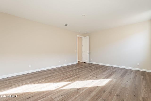 spare room featuring light wood-type flooring