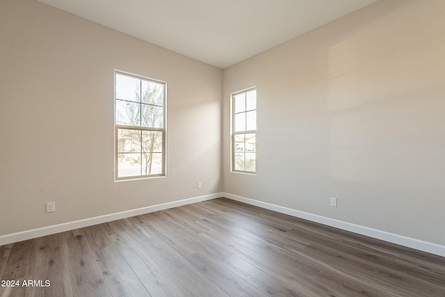 empty room with wood-type flooring