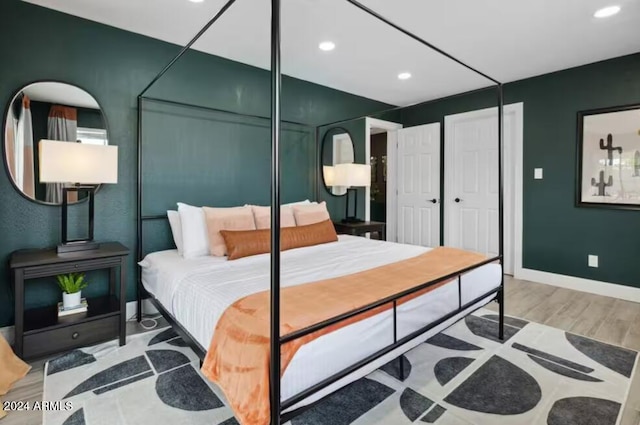 bedroom featuring wood-type flooring