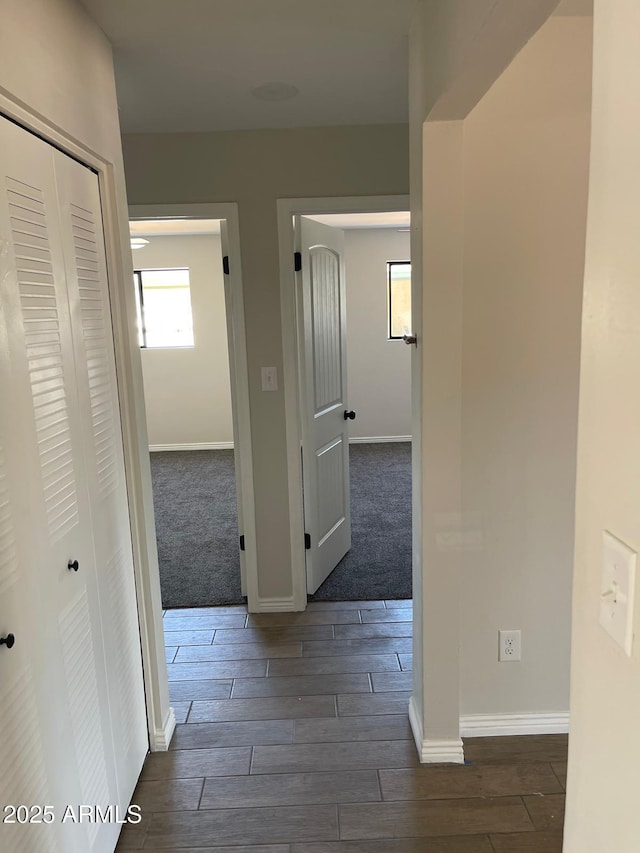 corridor with dark wood-type flooring