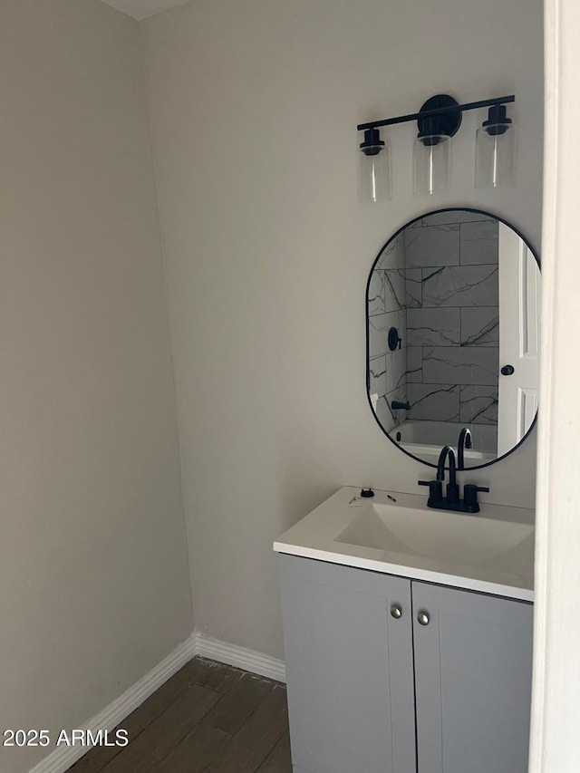 bathroom featuring shower / bath combination, wood-type flooring, and vanity