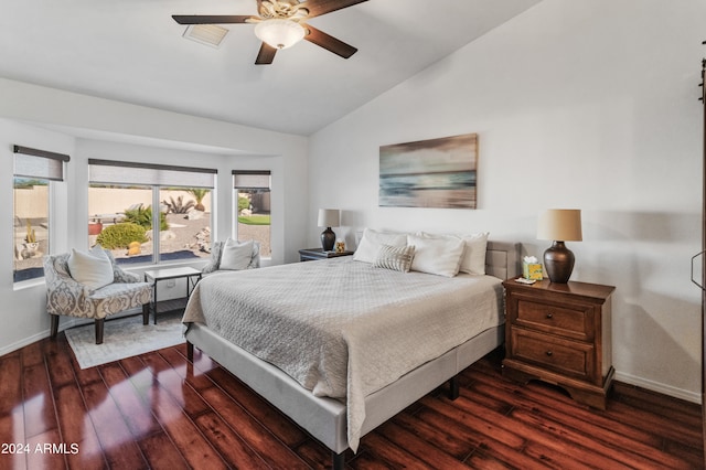 bedroom with dark wood-type flooring, ceiling fan, and vaulted ceiling