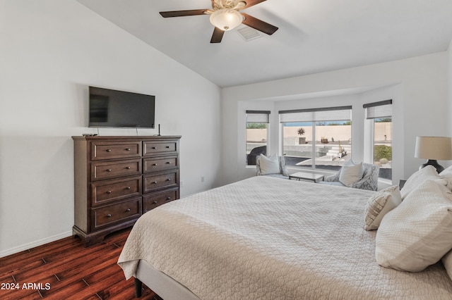 bedroom with lofted ceiling, dark hardwood / wood-style floors, and ceiling fan