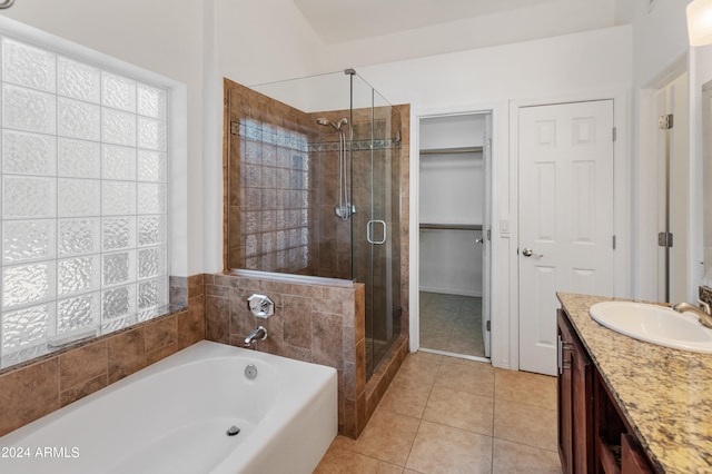 bathroom featuring vanity, separate shower and tub, and tile patterned flooring