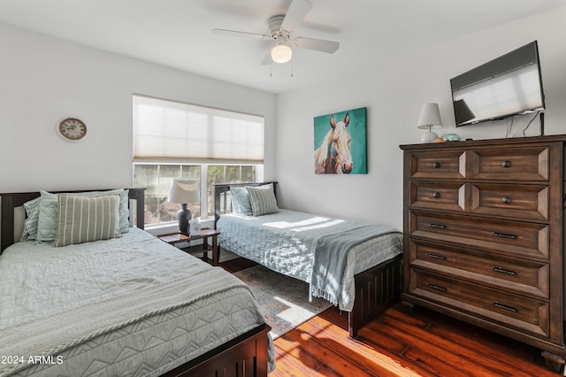 bedroom featuring dark wood-type flooring and ceiling fan