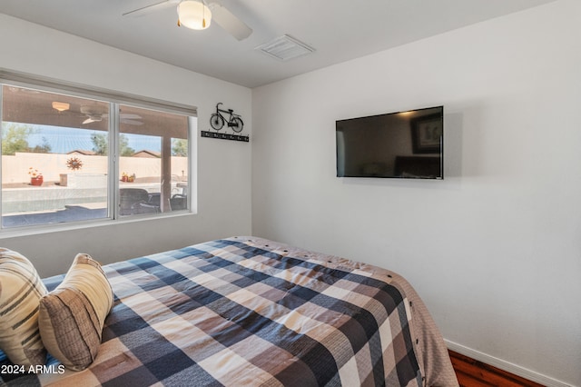 bedroom featuring ceiling fan and dark hardwood / wood-style floors