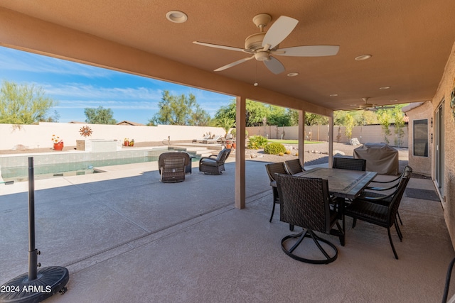 view of patio featuring a grill and ceiling fan