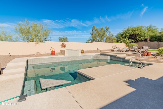 view of swimming pool with a patio area