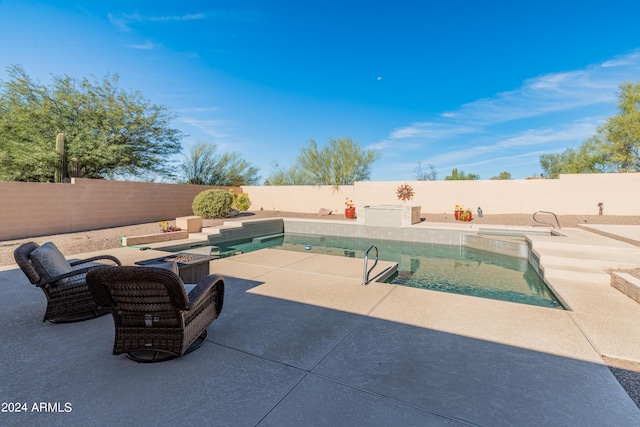 view of swimming pool featuring a patio area