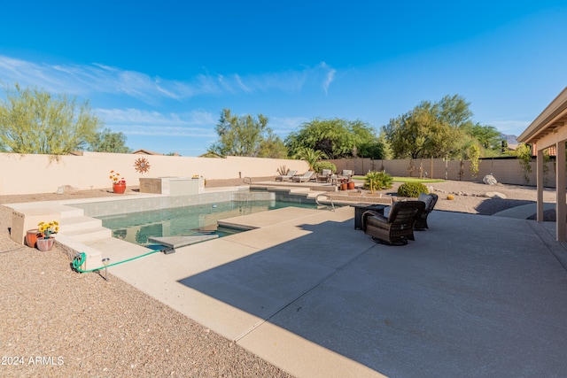 view of pool featuring a patio