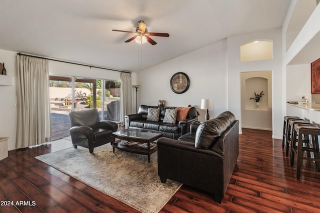 living room featuring lofted ceiling, ceiling fan, and dark hardwood / wood-style flooring