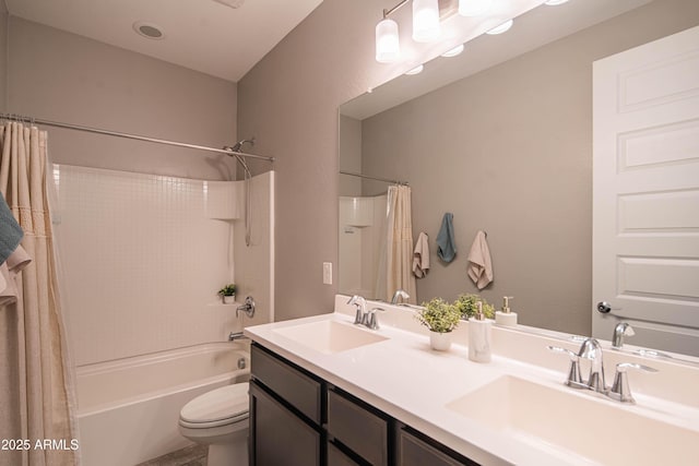 full bathroom featuring vanity, shower / bath combination with curtain, and toilet