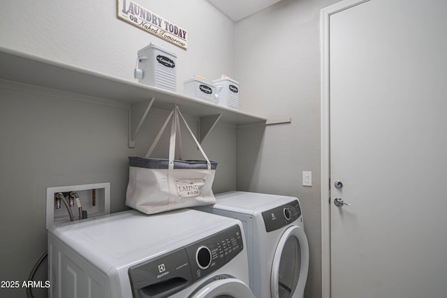 laundry room featuring washing machine and dryer