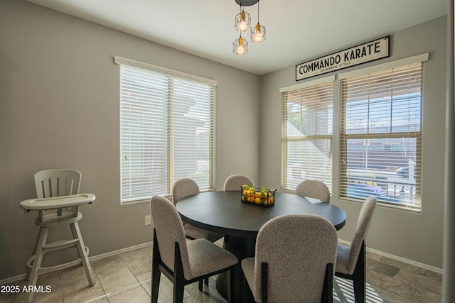 tiled dining area with a healthy amount of sunlight