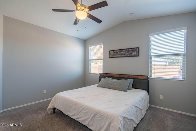 bedroom featuring vaulted ceiling, ceiling fan, and dark colored carpet