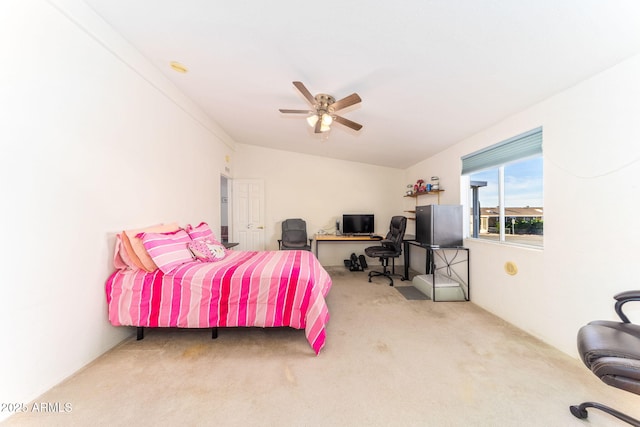 bedroom featuring ceiling fan and carpet