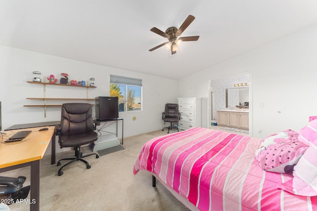 carpeted bedroom featuring ceiling fan, ensuite bath, and lofted ceiling