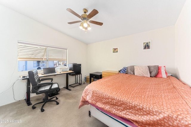 bedroom with ceiling fan, light colored carpet, and vaulted ceiling