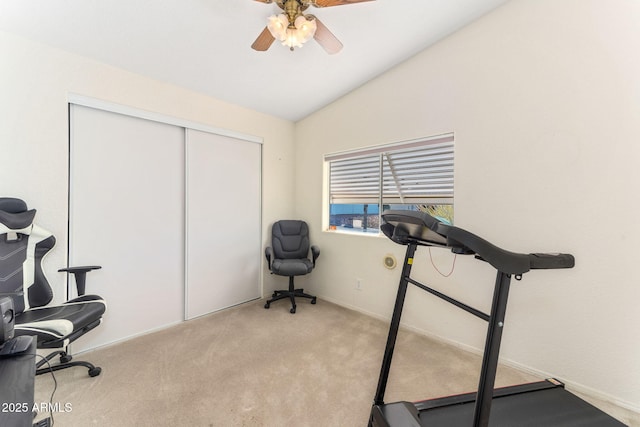 workout room featuring ceiling fan, light carpet, and lofted ceiling