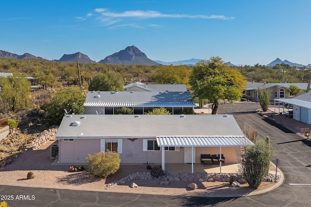 drone / aerial view featuring a mountain view