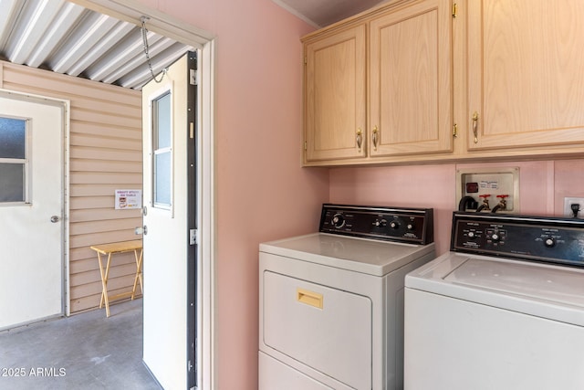 laundry area featuring cabinets and independent washer and dryer