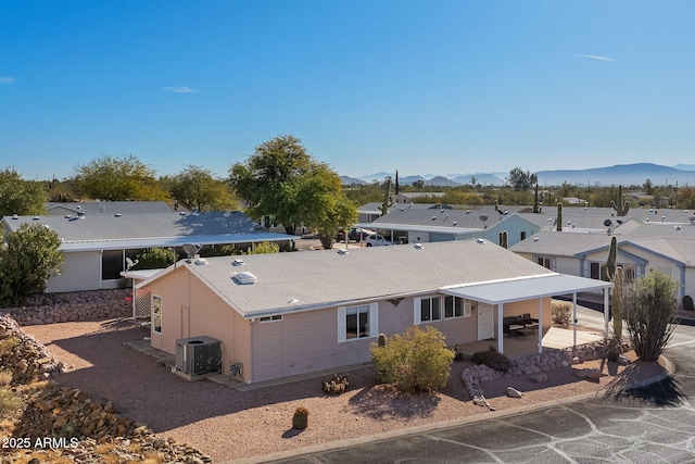 birds eye view of property with a mountain view