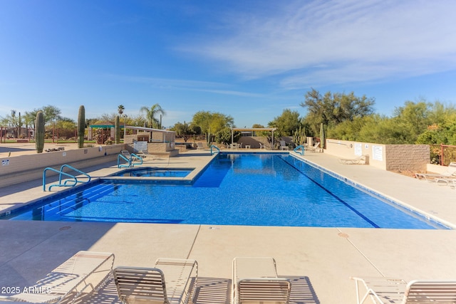 view of pool with a community hot tub and a patio