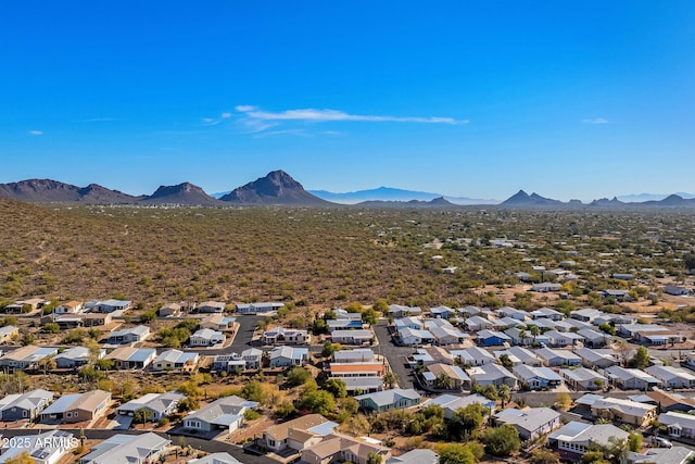 birds eye view of property with a mountain view