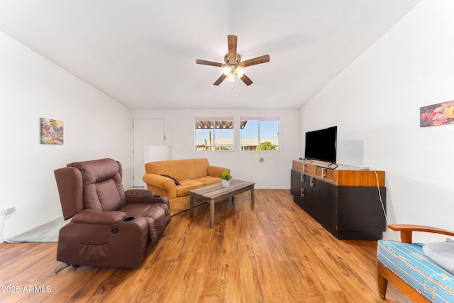 living room with ceiling fan and light hardwood / wood-style floors