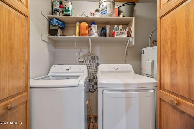 laundry room featuring water heater and washing machine and dryer