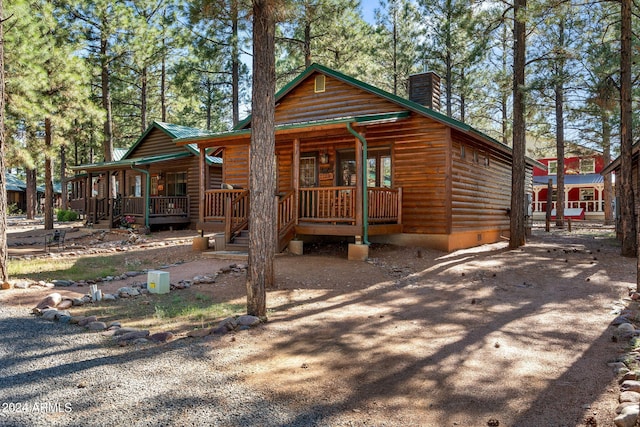 log cabin with covered porch