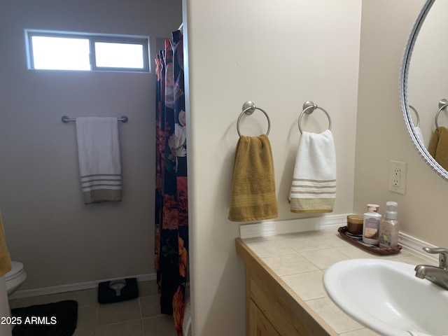 bathroom featuring a shower with curtain, tile patterned floors, toilet, and vanity